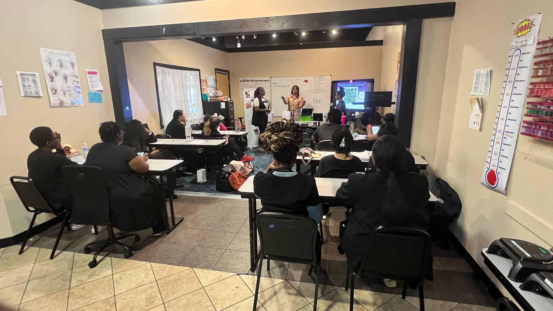 Nail technician students seated at the Beyond the Polish workshop