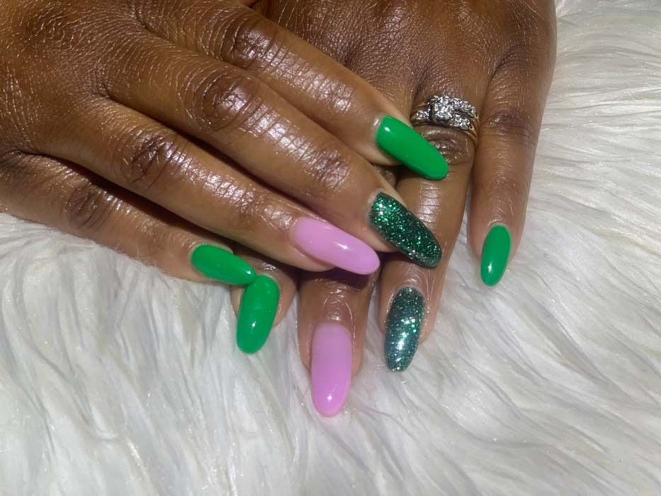 Green, glitter green, and pink coffin-shaped acrylic nails