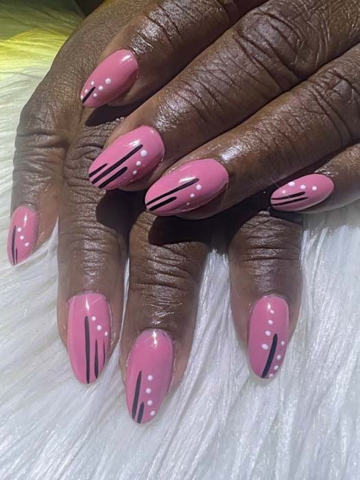 Pink manicure with black line and white dot nail art