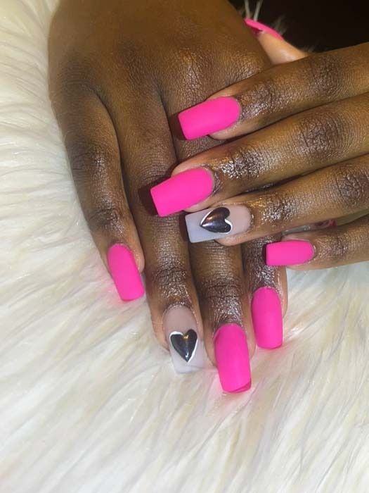 Matte hot pink coffin nails with heart nail art accents