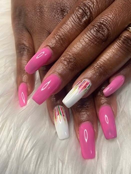 Pink glossy coffin nails with a colorful drip nail art accent