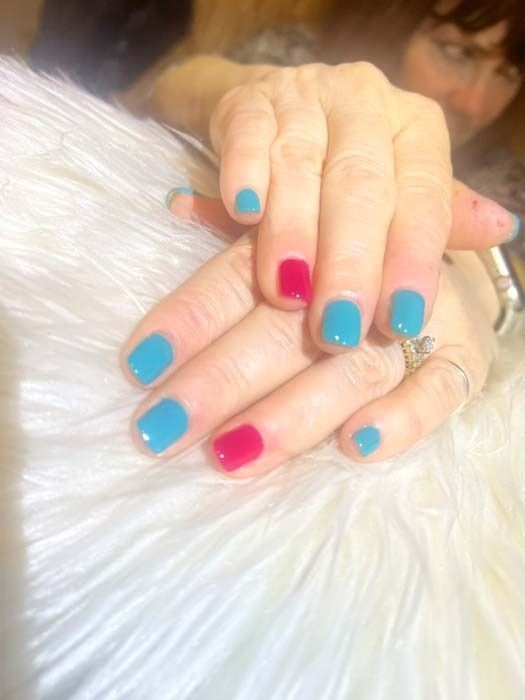 Teal and magenta short gel manicure