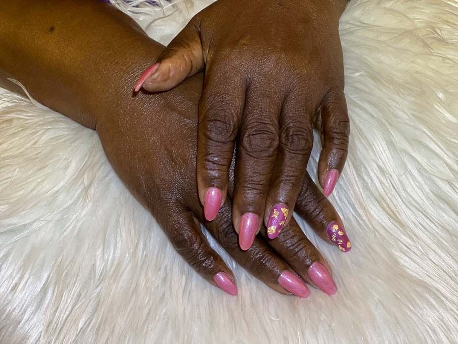 Pink glossy manicure with a gold nail art accent