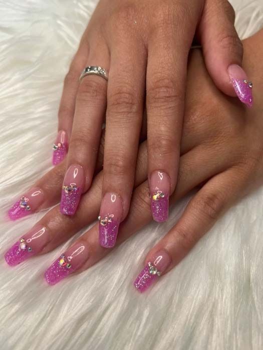 Pink glitter ombre coffin nails with rhinestone accents