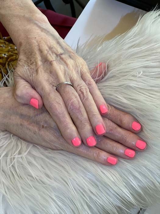 Coral pink manicure on natural nails