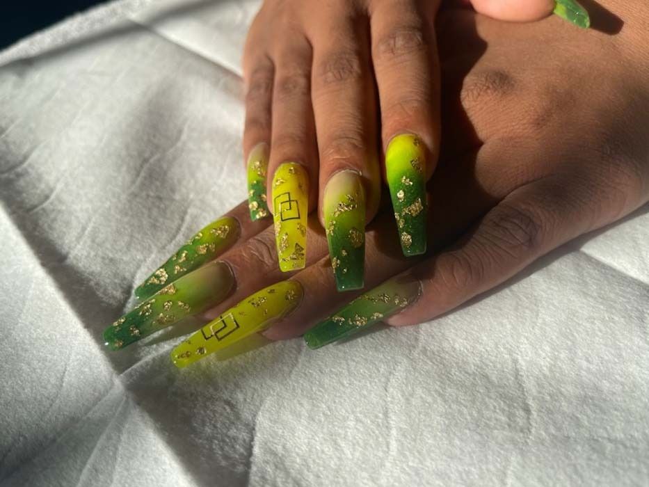Yellow-to-green ombre coffin nails with gold foil nail art