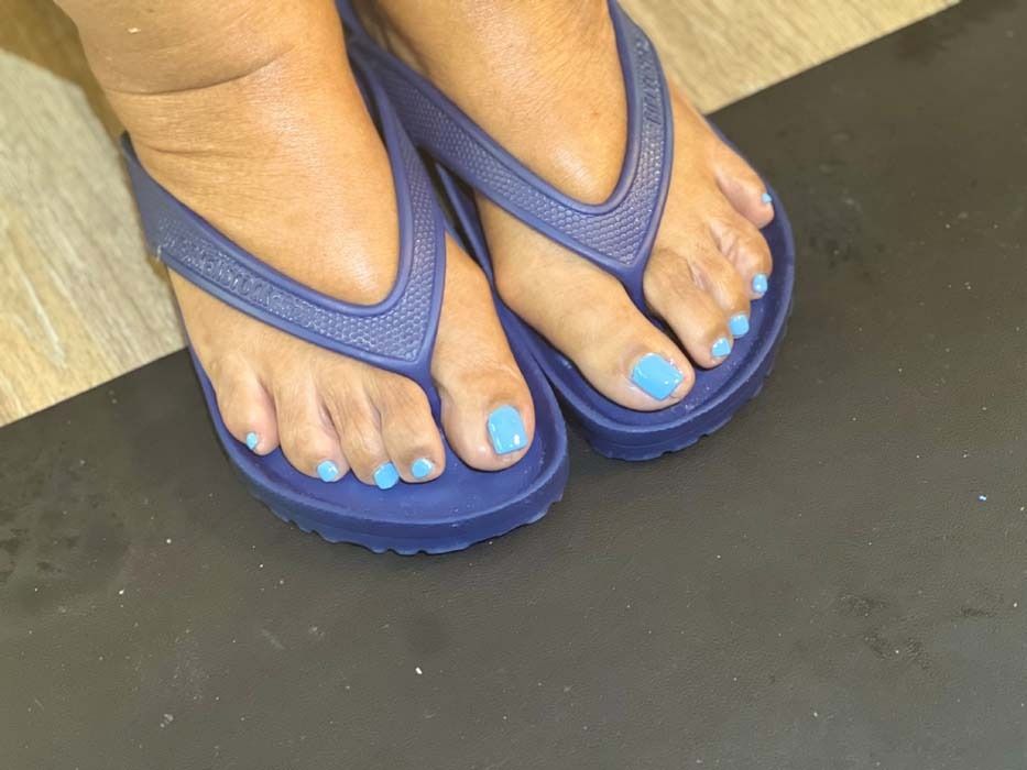 Blue pedicure toenails, close-up