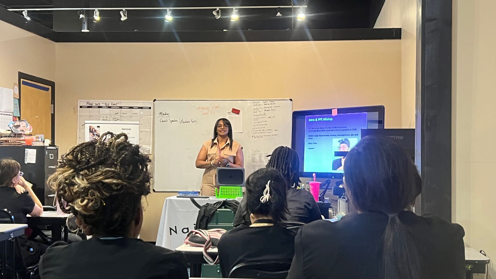 Leilani Ross presenting the Beyond the Polish workshop to nail technician students at Georgia Career Institute